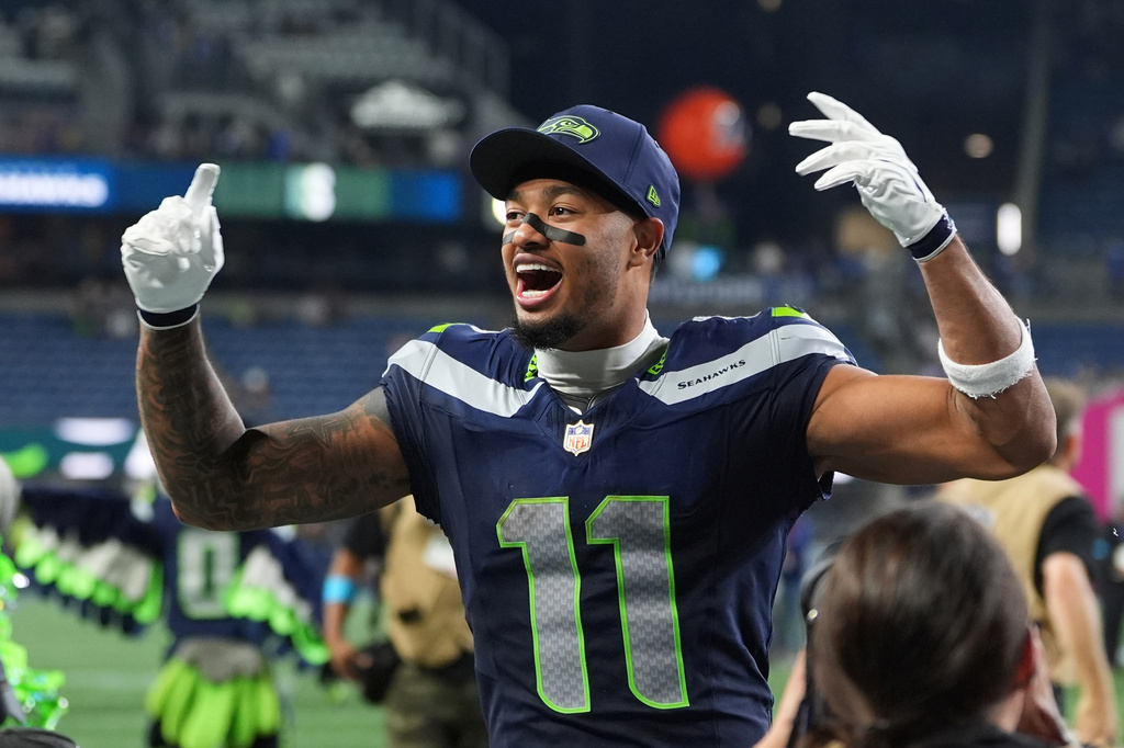 Seattle Seahawks wide receiver Jaxon Smith-Njigba speaks celebrates after winning an NFL football game against the New England Patriots, Wednesday, Sept. 9, 2026, in Seattle. (AP Photo/Lindsey Wasson)