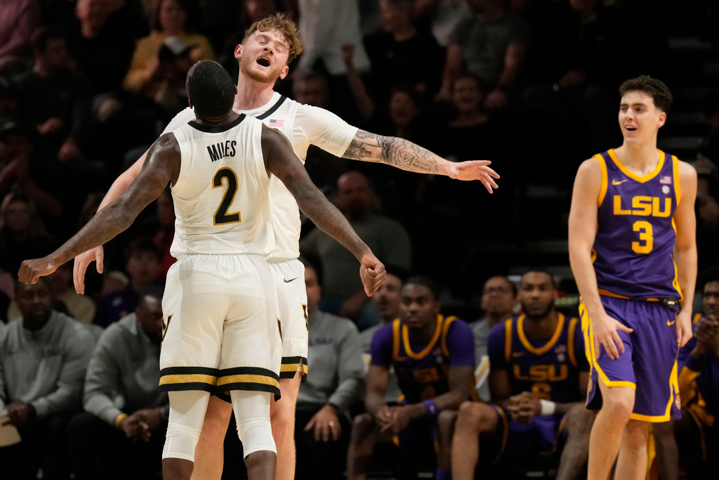 Vanderbilt guard Duke Miles (2) and forward Tyler Nickel, right, celebrate, during the first half of an NCAA college basketball game against LSU, Saturday, Jan. 10, 2026, in Nashville, Tenn. (AP Photo/George Walker IV)