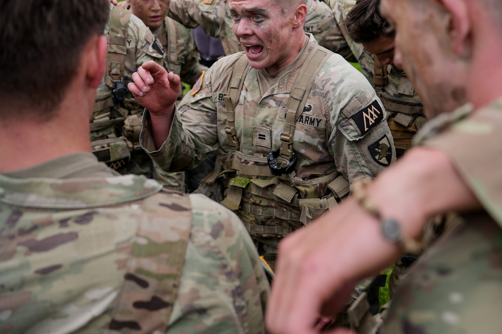 West Point cadets huddle after completing the crucible portion of the Sandhurst Military Skills Competition at the United States Military Academy in West Point, N.Y., Saturday, May 2, 2026. (AP Photo/Julia Demaree Nikhinson)