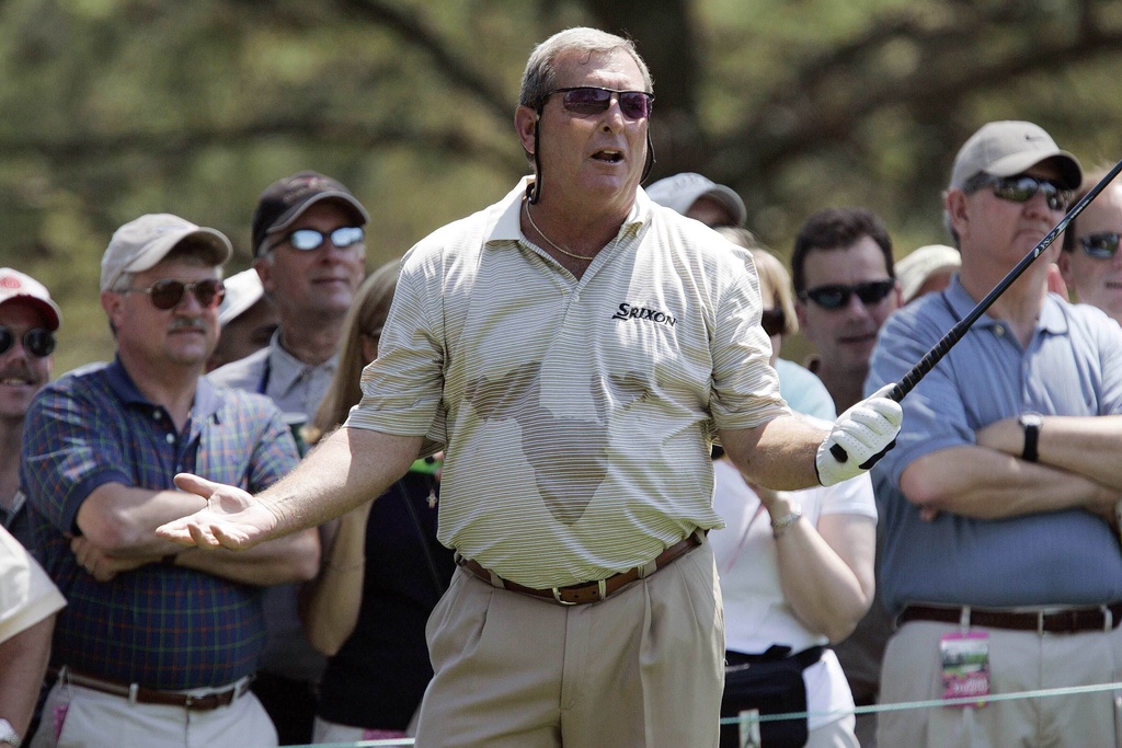 FILE - Fuzzy Zoeller talks with patrons on the 15th tee during practice at the Augusta National Golf Club in Augusta, Ga., Tuesday, April 5, 2005. (AP Photo/Chris O'Meara, File)