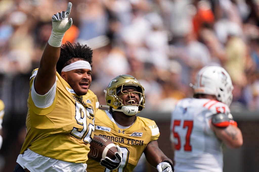 Georgia Tech defensive lineman Christian Speakman (92) celebrtes his fumble recovery against Mercer in the first half of an NCAA college football game, Saturday, Sept. 19, 2026, in Atlanta. (AP Photo/Mike Stewart)