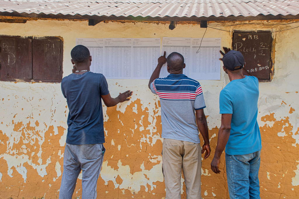 Voters check for their names at a polling station in Brazzaville, the Republic of Congo, Sunday, March 15, 2026. (AP Photo/Vivace Mambouana)