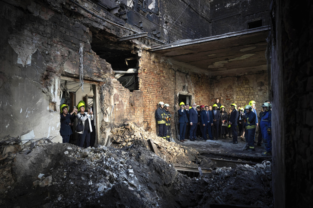 In this photo provided by the Press Service Of Prime minister Of Ukraine on Sept. 8, 2025, representatives of diplomatic missions check destruction at the Cabinet of Ministers building damaged after a Russian attack in Kyiv, Ukraine. (Press Service Of Prime minister Of Ukraine via AP)