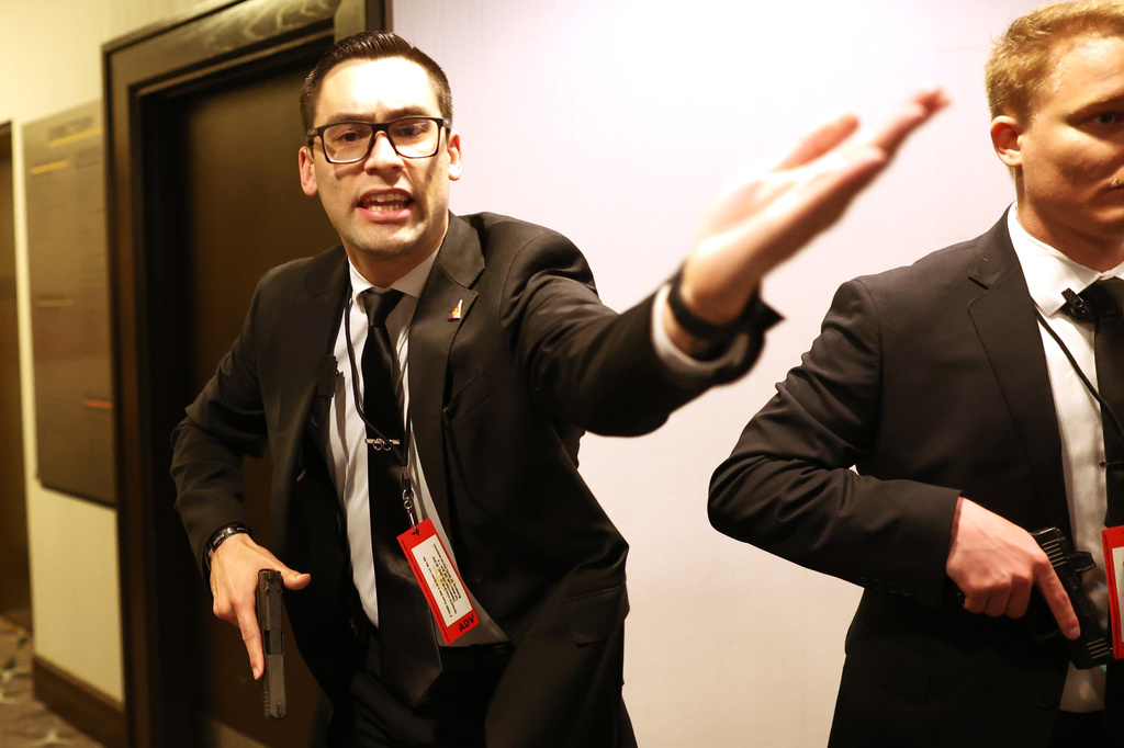 Secret service agents respond during the White House Correspondents Dinner, Saturday, April 25, 2026, in Washington. (AP Photo/Tom Brenner)