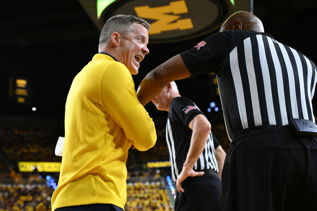 Michigan head coach Dusty May argues with the officials during a break in the action against Michigan State in the first half of an NCAA college basketball game in Ann Arbor, Mich., Sunday, March 8, 2026. (AP Photo/Lon Horwedel)