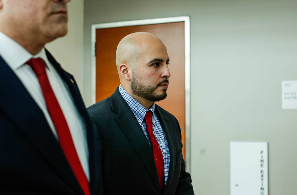 FILE - New York police officer Erik Duran, who is charged with hurling a plastic cooler at a man fleeing officers on a motorized scooter, causing a crash that killed the driver, arrives to his manslaughter trial at the Bronx Criminal Court in New York, Feb. 6, 2026. (AP Photo/Kena Betancur, File)