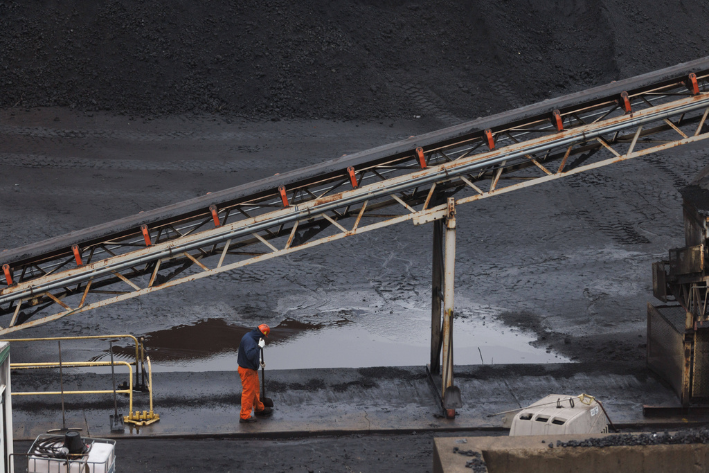 A worker in the coal fields at U.S. Steel's Clairton Coke Works in Clairton, Pa., on Wednesday, Nov. 19, 2025. (Quinn Glabicki/Pittsburgh's Public Source via AP)