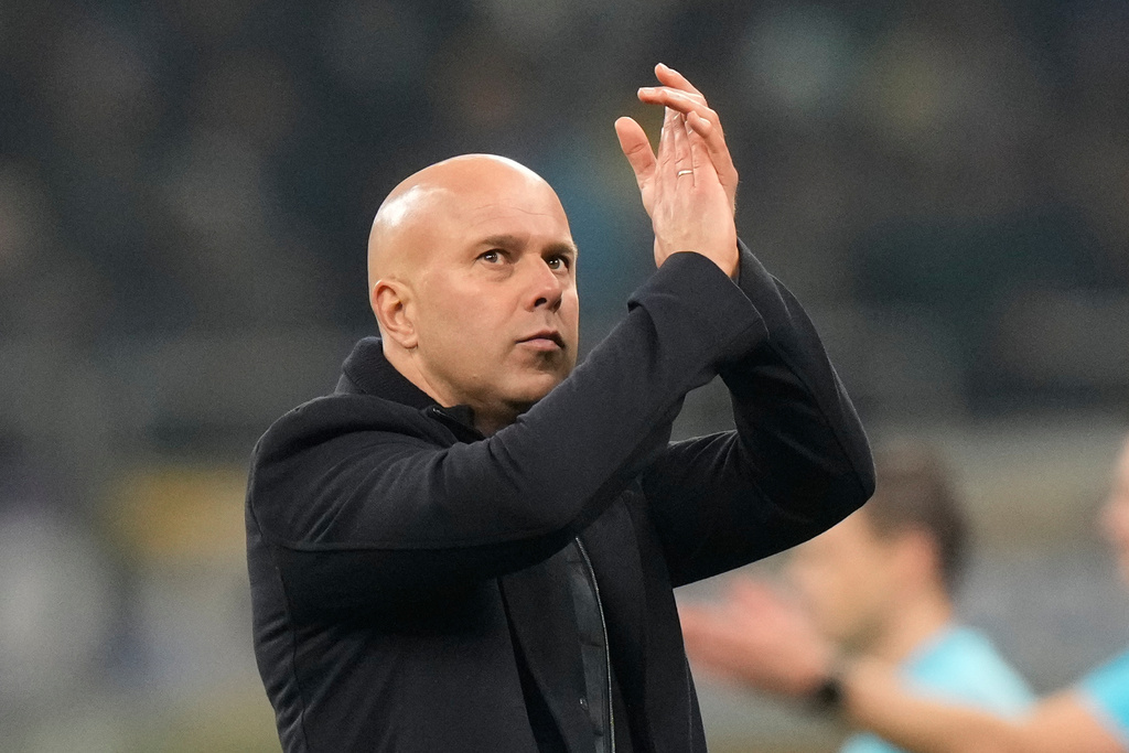 Liverpool's manager Arne Slot applauds at the end of a Champions League, league phase, soccer match between Inter Milan and Liverpool in Milan, Italy, Tuesday, Dec.9, 2025. (AP Photo/Luca Bruno)