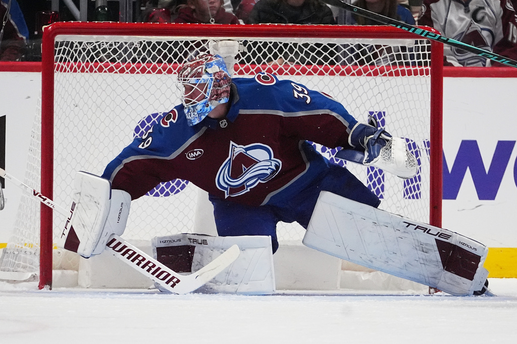 Colorado Avalanche goaltender Mackenzie Blackwood looks for a shot in the third period of an NHL hockey game against the San Jose Sharks Wednesday, Nov. 26, 2025, in Denver. (AP Photo/David Zalubowski)