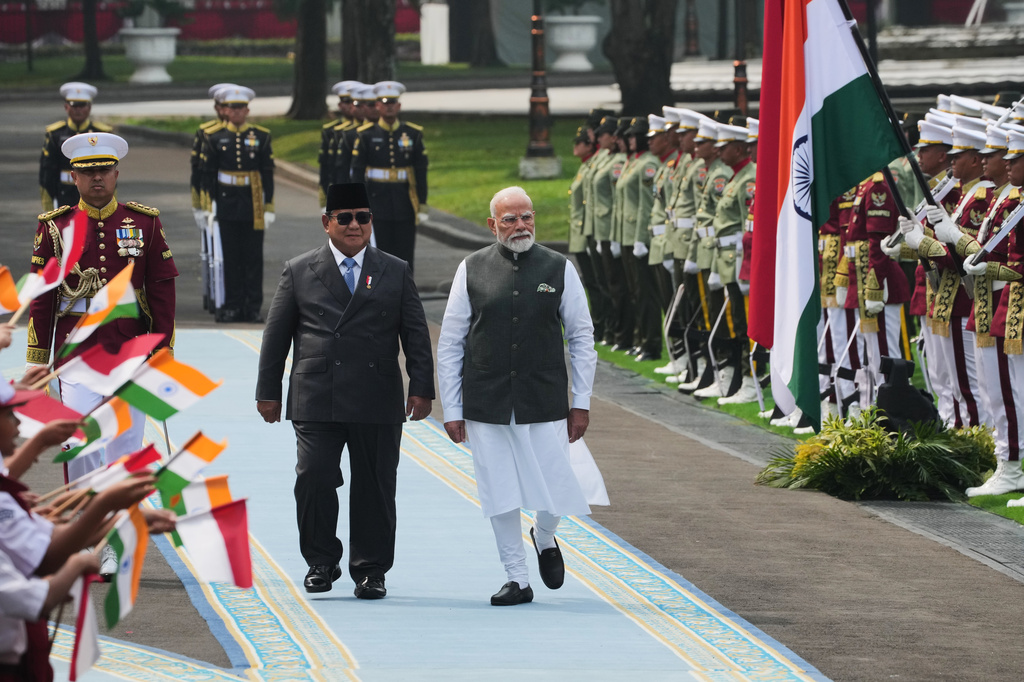 India's Prime Minister Narendra Modi, right, and Indonesia's President Prabowo Subianto inspect honor guards during the welcoming ceremony ahead of their meeting at Merdeka Palace in Jakarta, Indonesia, Tuesday, July 7, 2026. (AP Photo/Achmad Ibrahim)