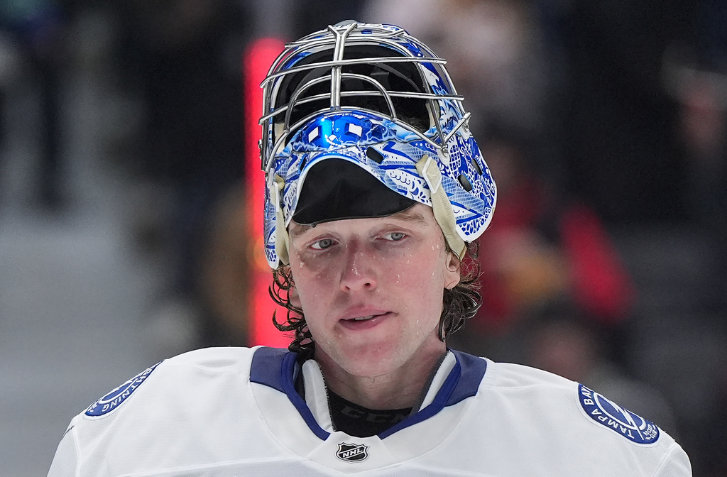 Tampa Bay Lightning goalie Andrei Vasilevskiy looks on during a stoppage in play during the third period of an NHL hockey game against the Vancouver Canucks, in Vancouver, British Columbia, Thursday, March 19, 2026. (Darryl Dyck/The Canadian Press via AP)