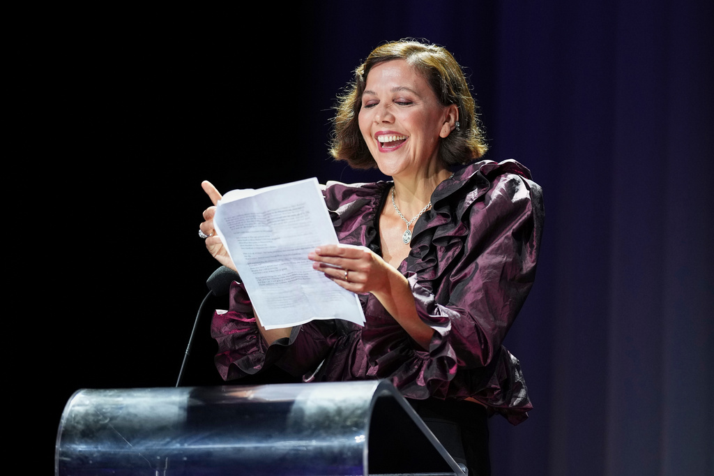 Maggie Gyllenhaal speaks to the audience prior to Ellen Burstyn receiving the golden lion for lifetime achievement during the 83rd edition of the Venice Film Festival in Venice, Italy, on Monday, Sept. 7, 2026. (Photo by Scott A Garfitt/Invision/AP)