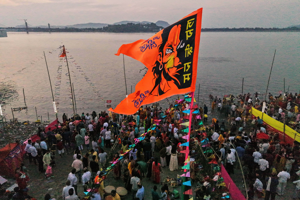 Indian Hindu devotees perform rituals in the the river Brahmaputra during the Chhath Puja festival in Guwahati, India, Monday, Oct. 27, 2025. (AP Photo/Anupam Nath)
