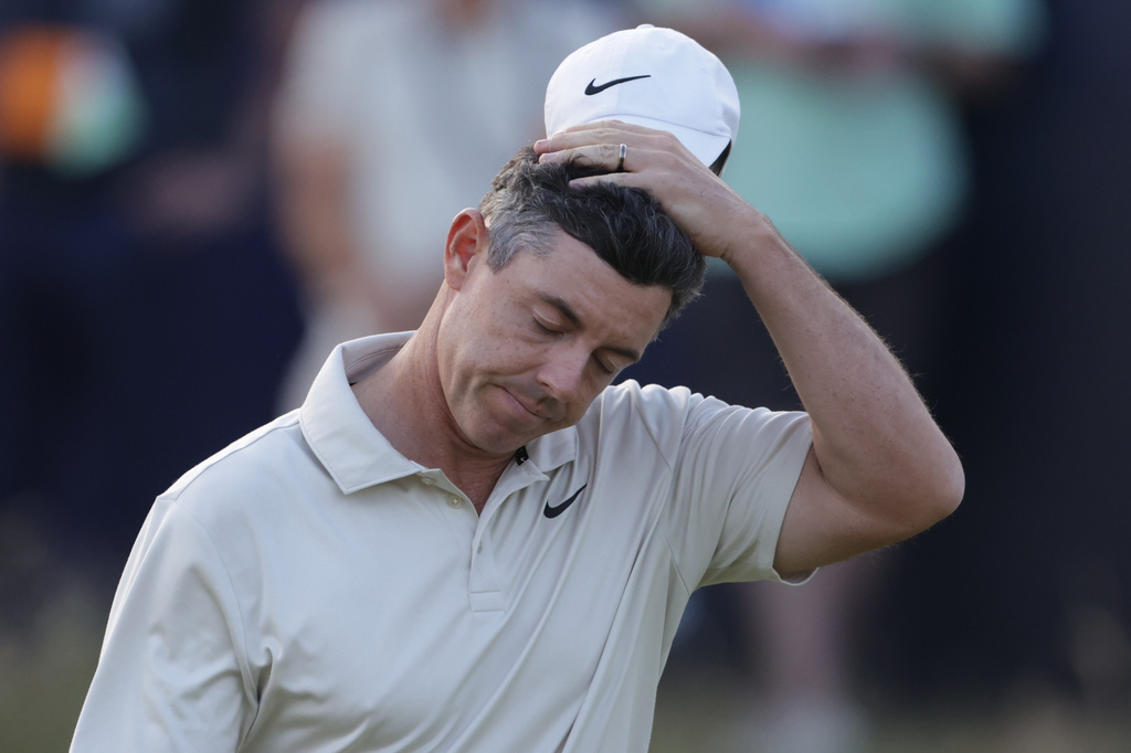 Rory McIlroy of Northern Ireland reacts after putting on the 18th green to complete his first round during the first day of the British Open Golf championships at Royal Birkdale golf club, in Southport, England, Thursday, July 16, 2026. (AP Photo/Peter Morrison)