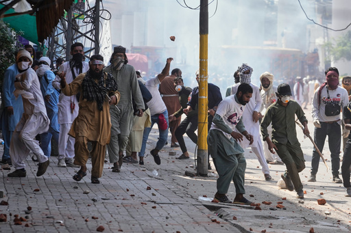 Supporters of Islamist party 'Tehreek-e-Labbaik Pakistan' throw stones toward police during clashes ahead of their pro-Palestinian march toward capital Islamabad, in Lahore, Pakistan, Friday, Oct. 10, 2025. (AP Photo/K.M. Chaudary) Supporters of Islamist party 'Tehreek-e-Labbaik Pakistan' throw stones toward police during clashes ahead of their pro-Palestinian march toward capital Islamabad, in Lahore, Pakistan, Friday, Oct. 10, 2025. (AP Photo/K.M. Chaudary)