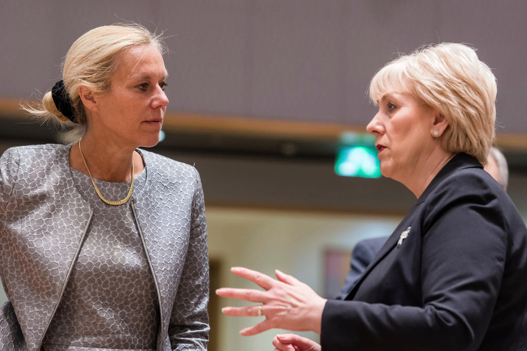 FILE - Dutch Trade Minister Sigrid Kaag, left, talks with Ireland's Business, Enterprise and Innovation Minister Heather Humphreys during an EU foreign affairs council on trade at the Europa building in Brussels on May 22, 2018. (AP Photo/Geert Vanden Wijngaert, File)