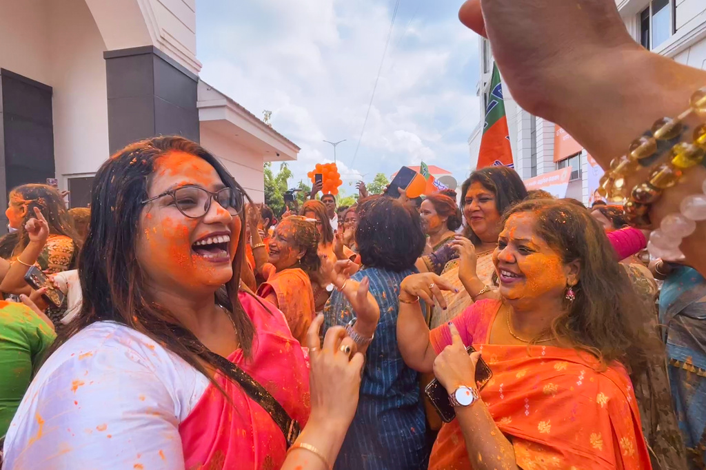 Bharatiya Janata Party workers shout slogans and celebrate the party's early results and lead in the recently held state election, in Guwahati, India, Monday, May 4, 2026. (AP Photo/Anupam Nath)