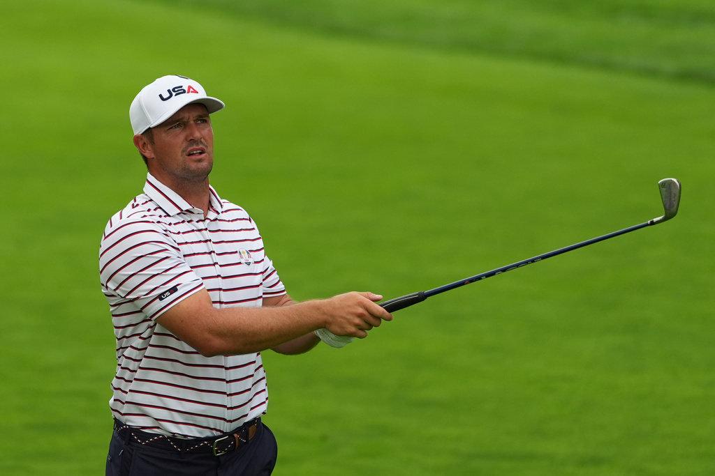 Bryson DeChambeau hits from the fairway on the first hole during a practice round for the Ryder Cup golf tournament, Wednesday, Sept. 24, 2025, on the Bethpage Black golf course, in Farmingdale, N.Y. (AP Photo/Lindsey Wasson)