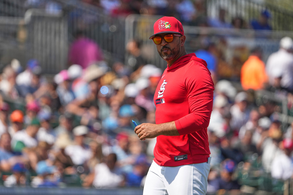 St. Louis Cardinals manager Oliver Marmol walks back from the mound after making a pitching change during the second inning of a spring training baseball game against the New York Mets Friday, Feb. 27, 2026, in Jupiter, Fla. (AP Photo/Jeff Roberson)