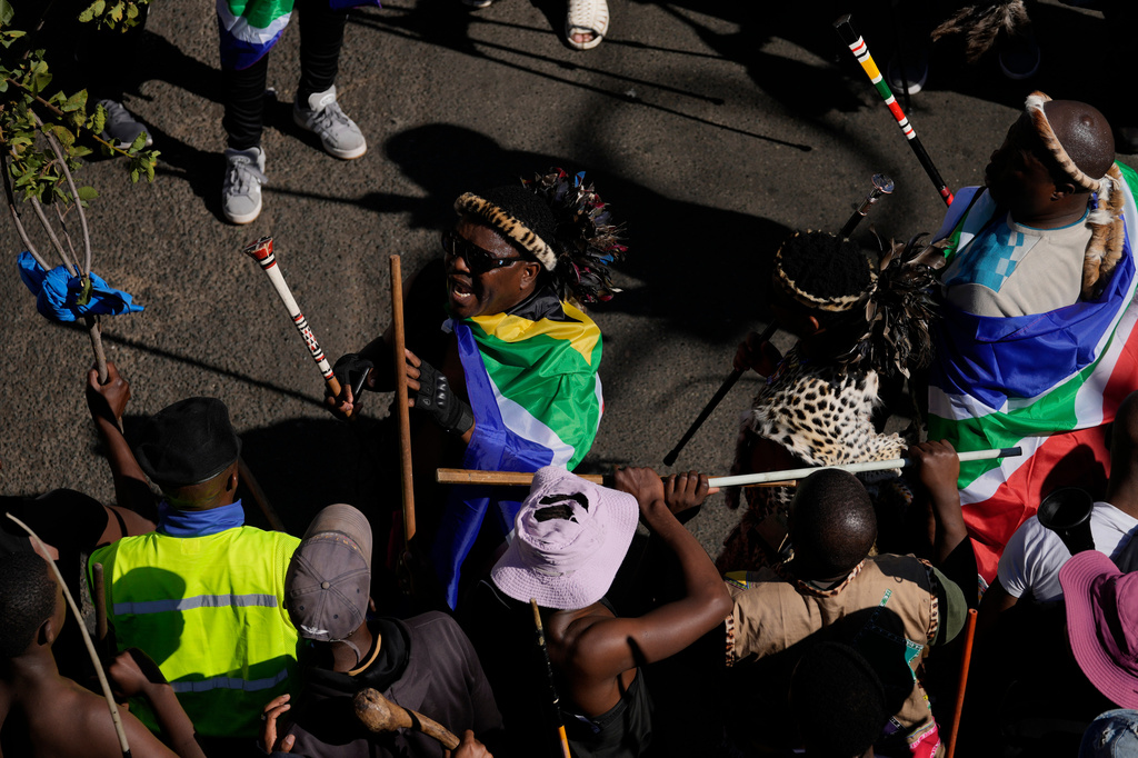 People attend a protest against illegal immigration, in Johannesburg, South Africa, Tuesday, June 30, 2026. (AP Photo/Themba Hadebe)