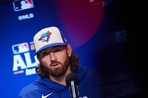 Toronto Blue Jays' Kevin Gausman speaks with the media ahead of Game 1 of baseball's American League Championship Series against the Seattle Mariners in Toronto, Saturday, Oct. 11, 2025. (Sammy Kogan/The Canadian Press via AP) Toronto Blue Jays' Kevin Gausman speaks with the media ahead of Game 1 of baseball's American League Championship Series against the Seattle Mariners in Toronto, Saturday, Oct. 11, 2025. (Sammy Kogan/The Canadian Press via AP)