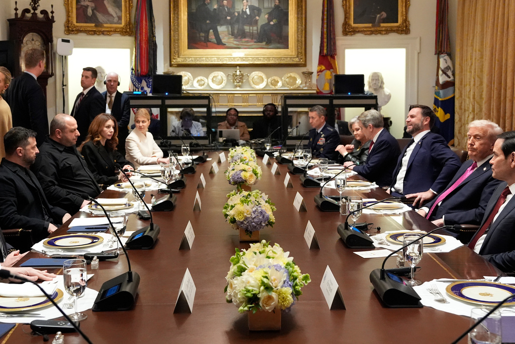 President Donald Trump, second right, and Ukraine's President Volodymyr Zelenskyy, left, sit with Secretary of State Marco Rubio, from right, Vice President JD Vance, Treasury Secretary Scott Bessent, White House Chief of Staff Susie Wiles and Chairman of the Joint Chiefs of Staff Gen. Dan Caine before a lunch in the Cabinet Room of the White House, Friday, Oct. 17, 2025, in Washington. (AP Photo/Alex Brandon)