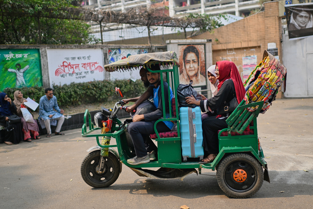 FILE - Students leave Dhaka University after the government ordered all universities to close, moving forward the Eid al-Fitr break as part of emergency measures to conserve electricity, in Dhaka, Bangladesh, Monday, March 9, 2026. (AP Photo/Mahmud Hossain Opu)