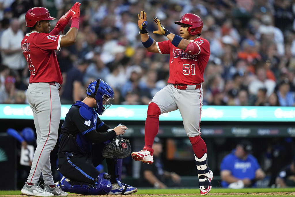 Los Angeles Angels' Gustavo Campero, right, celebrates with teammate Christian Moore, who also scored, after hitting a two-run home run during the fifth inning of a baseball game against the Detroit Tigers, Friday, Aug. 8, 2025, in Detroit. (AP Photo/Ryan Sun)