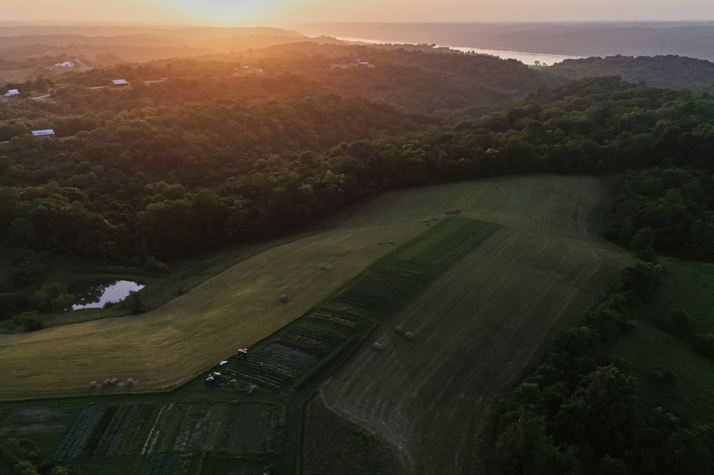 The sun sets Wednesday, July 1, 2026, over a farm in Brooksville, Ky. (AP Photo/Joshua A. Bickel)
