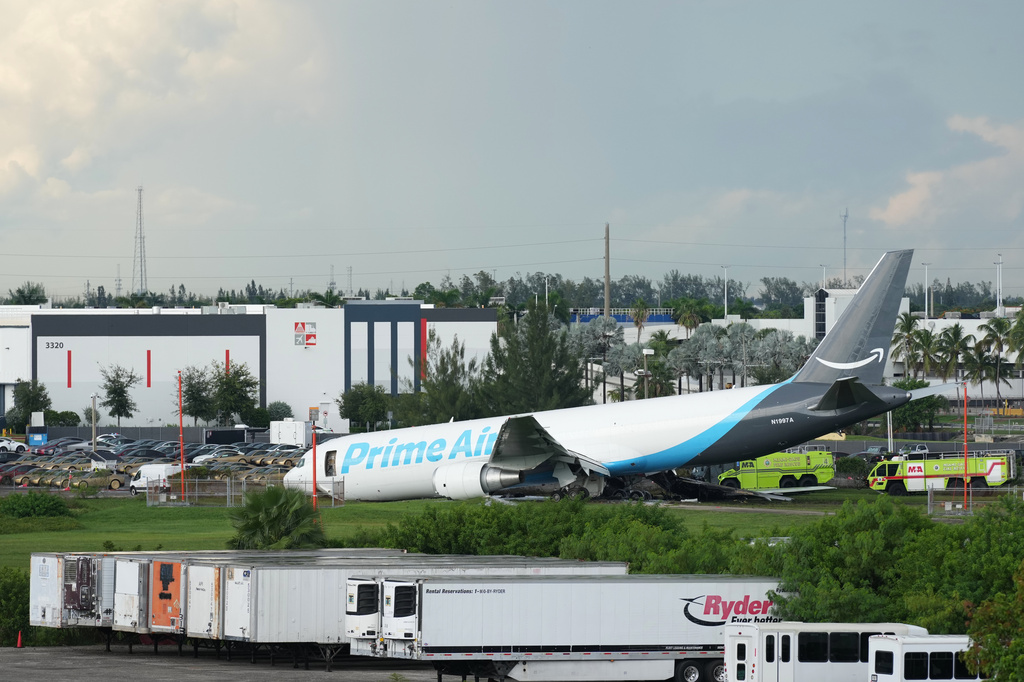 An Amazon cargo plane sits at the Miami International Airport (MIA) after it overshot the runway, Sunday, Sept. 6, 2026. (AP Photo/Lynne Sladky)