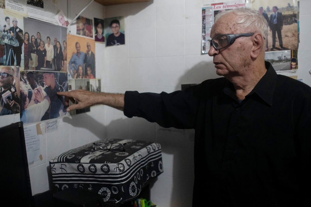 Nelson Faria Marinho, who lost his son Nelson Marinho in the Air France flight 447 plane crash near the coast of Brazil on June 1, 2009, points to a photo of him during an interview at his home in Rio de Janeiro, Thursday, May 21, 2026. (AP Photo/Bruna Prado)