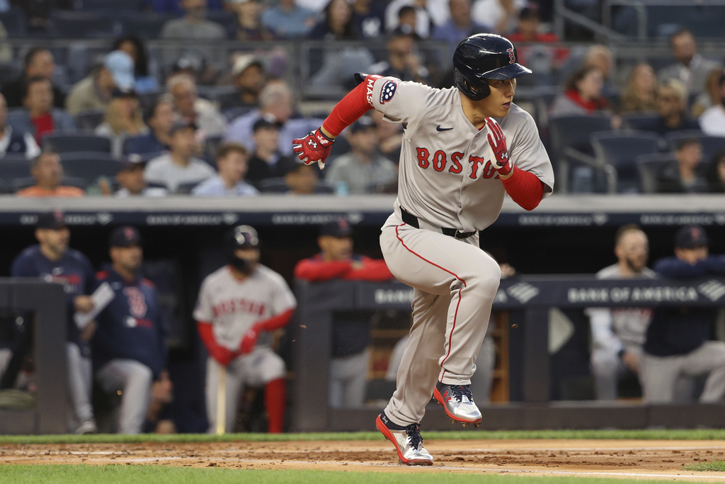Boston Red Sox's Masataka Yoshida runs to first base during the second inning of a baseball game against the New York Yankees, Thursday, Aug. 21, 2025, in New York. (AP Photo/Pamela Smith)