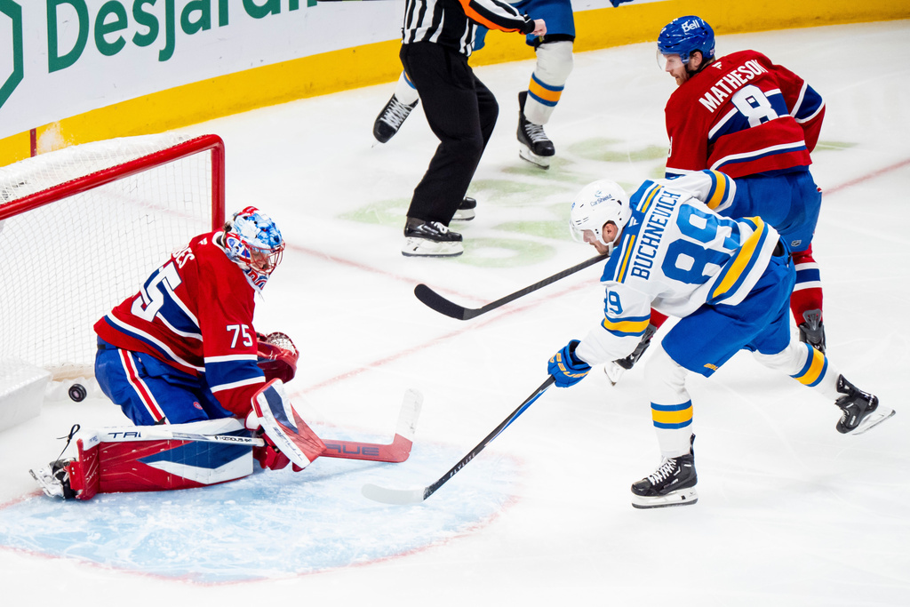 St. Louis Blues' Pavel Buchnevich (89) scores against Montreal Canadiens goaltender Jakub Dobes (75) while Canadiens' Mike Matheson (8) defends during second-period NHL hockey game action in Montreal, Sunday, Dec. 7, 2025. (Christopher Katsarov/The Canadian Press via AP)