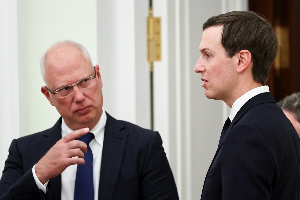 Putin's envoy Kirill Dmitriev, left, gestures speaking to U.S. President Donald Trump's envoy Jared Kushner prior to their meeting with Russian President Vladimir Putin at the Senate Palace of the Kremlin, in Moscow, Thursday, Jan. 22, 2026. (Alexander Kazakov/Sputnik, Kremlin Pool Photo via AP)
