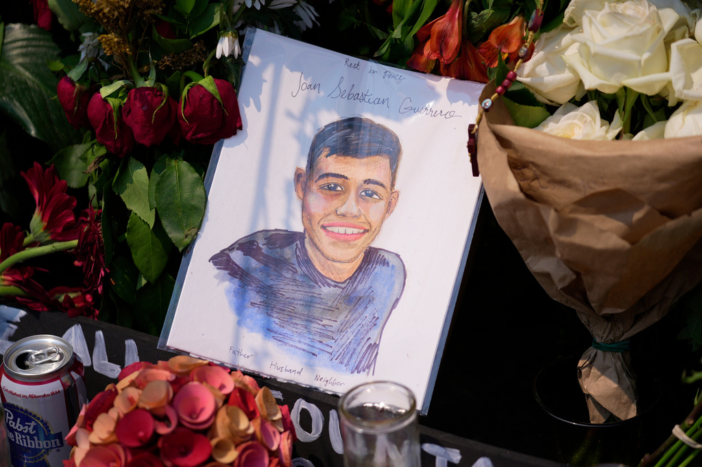 A portrait of Johan Sebastián Durán Guerrero, the man killed by U.S. Immigration and Customs Enforcement, is displayed among flowers and tributes at a makeshift memorial in Biddeford, Maine, Wednesday, July 15 2026. (AP Photo/Robert F. Bukaty)