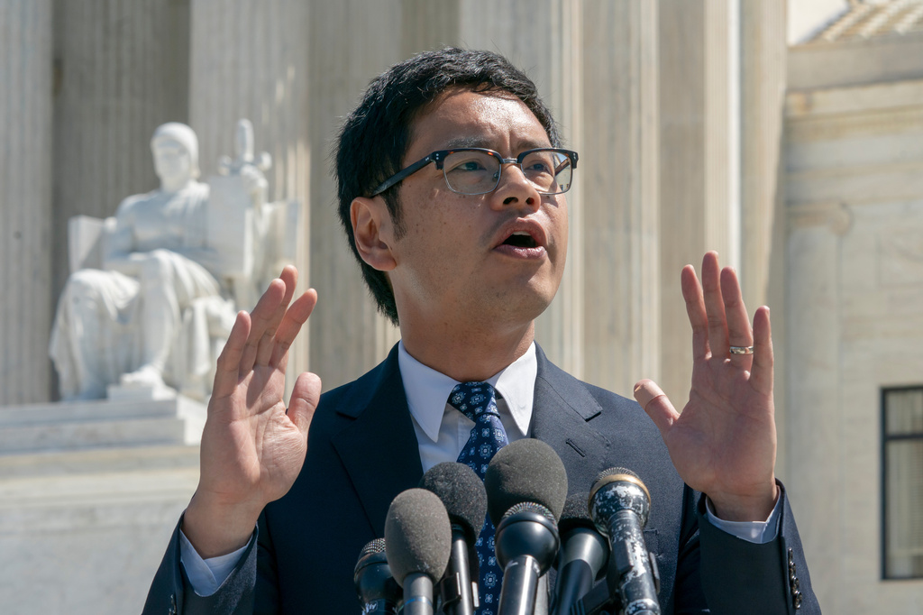 FILE - Dale Ho, an attorney for the American Civil Liberties Union, speaks to reporters after he argued before the Supreme Court against the Trump administration's plan to ask about citizenship on the 2020 census, in Washington, April 23, 2019. (AP Photo/J. Scott Applewhite, File)