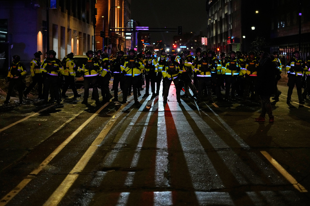 Minnesota State Patrol officers are seen during a protest and noise demonstration calling for an end to federal immigration enforcement operations in the city, Friday, Jan. 9, 2026, in Minneapolis. (AP Photo/John Locher)