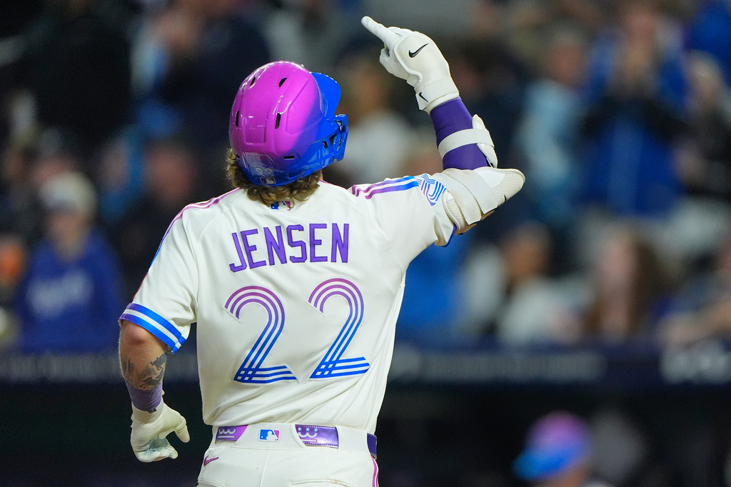 Kansas City Royals' Carter Jensen celebrates as he runs home after hitting a two-run home run during the eighth inning of a baseball game against the Cleveland Guardians, Friday, Sept. 25, 2026, in Kansas City, Mo. (AP Photo/Charlie Riedel)