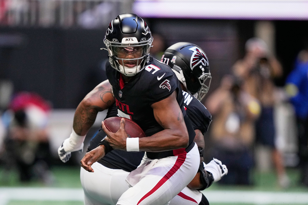 Atlanta Falcons quarterback Michael Penix Jr. (9) drops back against the Carolina Panthers in the first half of an NFL football game, Sunday, Nov. 16, 2025, in Atlanta. (AP Photo/Brynn Anderson)