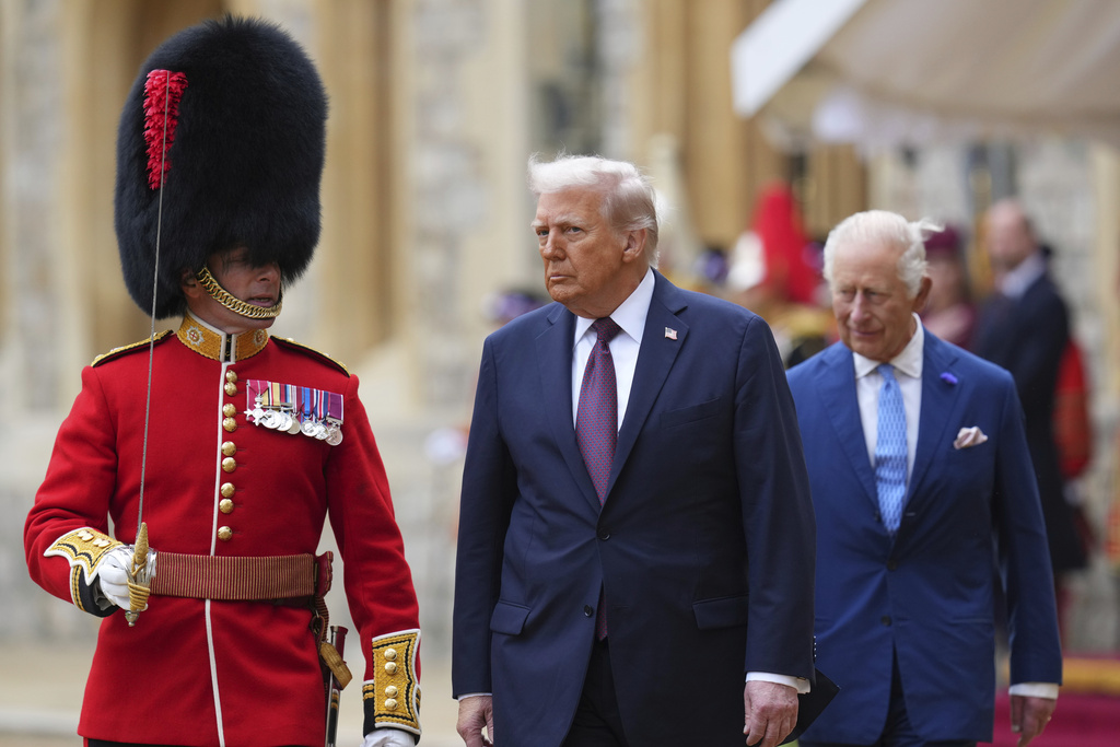 President Donald Trump and Britain's King Charles III review the Guard of Honour after the arrival at Windsor Castle in Windsor, England, Wednesday, Sept. 17, 2025.(AP Photo/Kirsty Wigglesworth, Pool)