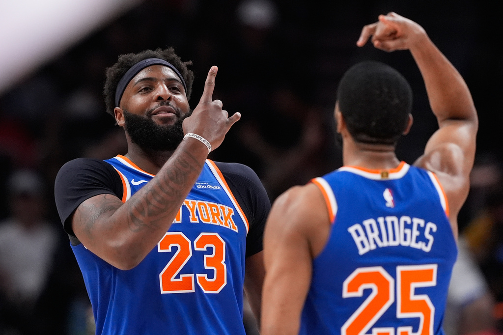 New York Knicks center Mitchell Robinson (23) celebrates after scoring in the first half during Game 6 in a first-round NBA basketball playoffs series against the Atlanta Hawks Thursday, April 30, 2026, in Atlanta. (AP Photo/Brynn Anderson)