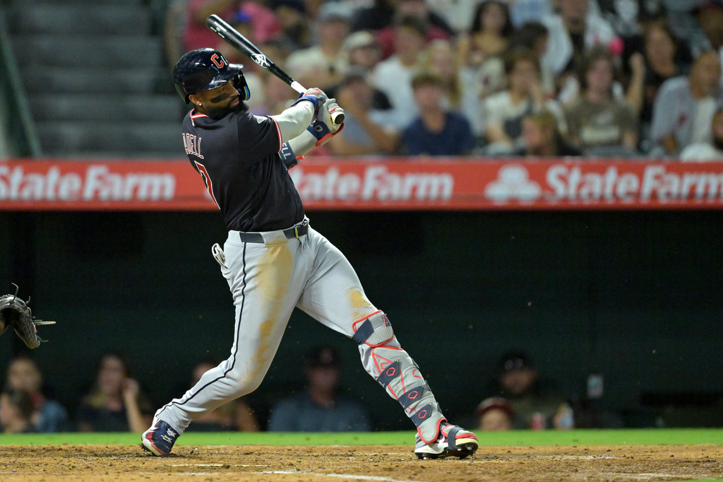 Cleveland Guardians' Jo Adell singles in a run during the fifth inning of a baseball game against the Los Angeles Angels, Monday, Aug. 24, 2026, in Anaheim, Calif. (AP Photo/Jayne Kamin-Oncea)