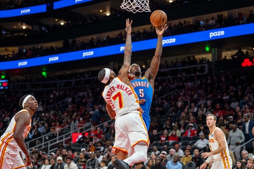 Oklahoma City Thunder guard Luguentz Dort (5), right, attempts a basket against Atlanta Hawks guard Nickeil Alexander-Walker (7) during the first half of an NBA basketball game, Saturday, Oct. 25, 2025, in Atlanta. (AP Photo/Erik Rank) Oklahoma City Thunder guard Luguentz Dort (5), right, attempts a basket against Atlanta Hawks guard Nickeil Alexander-Walker (7) during the first half of an NBA basketball game, Saturday, Oct. 25, 2025, in Atlanta. (AP Photo/Erik Rank)