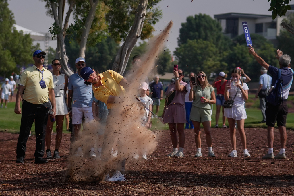 Tommy Fleetwood of England hits from the rough outside the 1st fairway during the third round of World Tour Golf Championship at Jumeirah Golf Estates, in Dubai, United Arab Emirates, Saturday, Nov. 15, 2025. (AP Photo/Altaf Qadri)