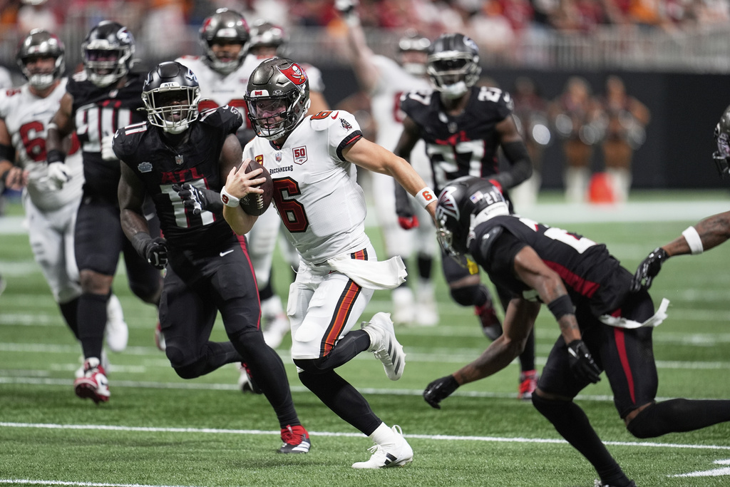 Tampa Bay Buccaneers quarterback Baker Mayfield (6) runs the ball during the second half of an NFL football game against the Atlanta Falcons, Sunday, Sept. 7, 2025, in Atlanta. (AP Photo/Mike Stewart)