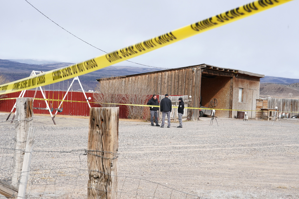 Authorities conduct an investigation at a home where a woman was found dead in Lyman, Utah, Thursday, March 5, 2026. (AP Photo/George Frey)