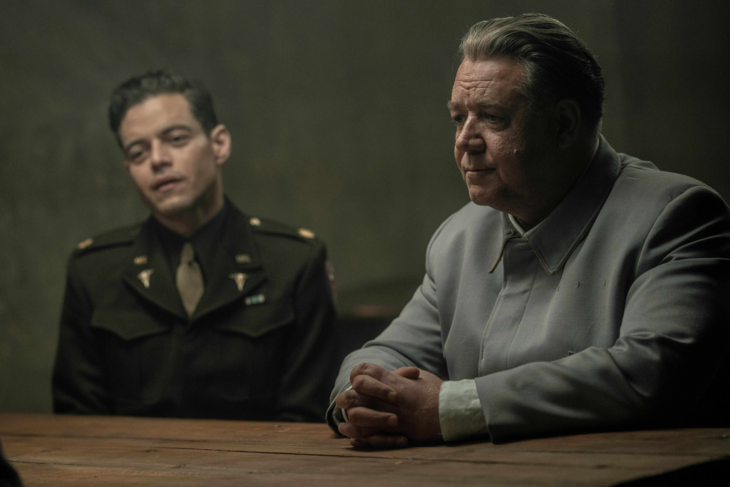 This image released by Sony Pictures Classics shows Rami Malek, left, and Russell Crowe in a scene from "Nuremberg." (Scott Garfield/Sony Pictures Classics via AP)