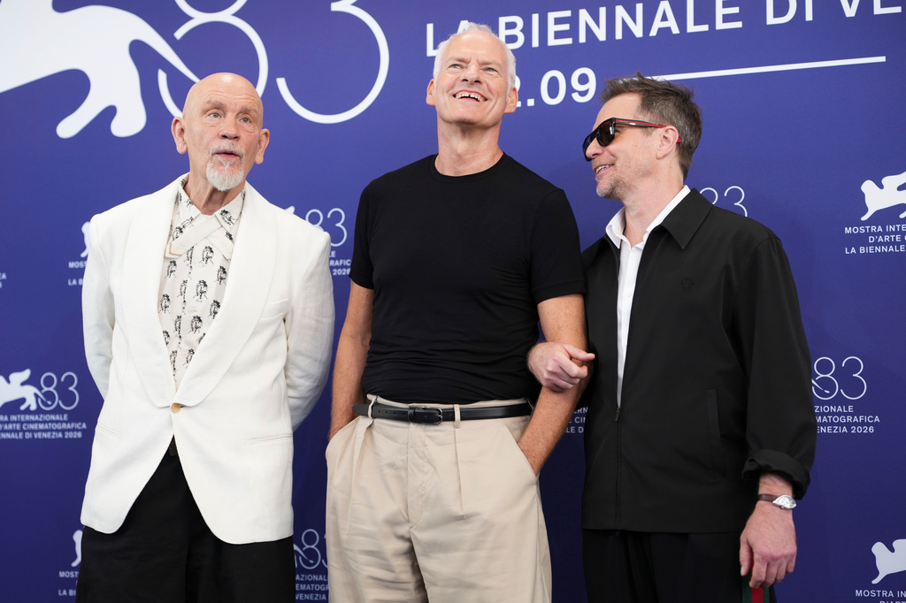John Malkovich, left, director Martin McDonagh and Sam Rockwell pose for photographers at the photo call for the film 'Wild Horse Nine' during the 83rd edition of the Venice Film Festival in Venice, Italy, on Thursday, Sept. 3, 2026. (Photo by Scott A Garfitt/Invision/AP)