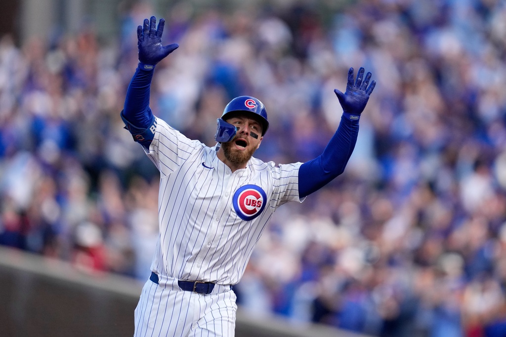 Chicago Cubs' Michael Busch celebrates after hitting a home run during the first inning of Game 3 of baseball's National League Division Series against the Milwaukee Brewers Wednesday, Oct. 8, 2025, in Chicago. (AP Photo/Erin Hooley)