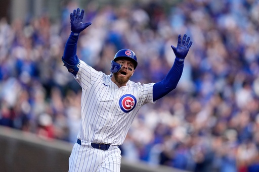 Chicago Cubs' Michael Busch celebrates after hitting a home run during the first inning of Game 3 of baseball's National League Division Series against the Milwaukee Brewers Wednesday, Oct. 8, 2025, in Chicago. (AP Photo/Erin Hooley) Chicago Cubs' Michael Busch celebrates after hitting a home run during the first inning of Game 3 of baseball's National League Division Series against the Milwaukee Brewers Wednesday, Oct. 8, 2025, in Chicago. (AP Photo/Erin Hooley)